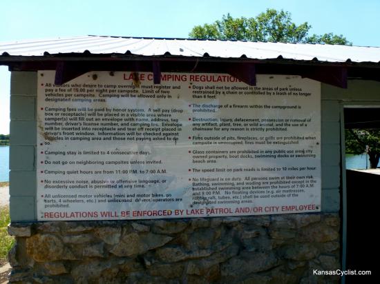 Lake Fort Scott - Regulations - This sign, affixed to the picnic shelter, details the rules and regulations in the camping area at Lake Fort Scott. The cost for camping is $5 per night, paid on the honor system via self-pay envelopes and a lock-box (located in the shelter).