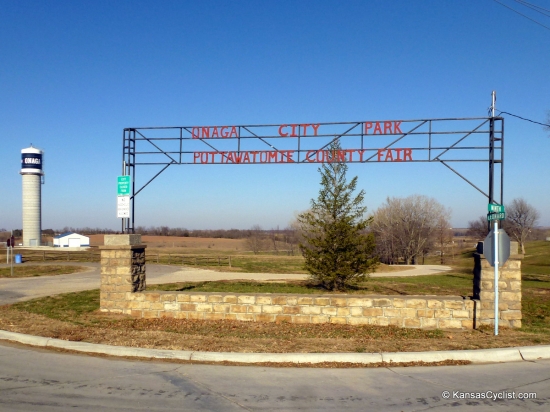 Onaga City Park - Entrance Sign - This is the entrance sign for Onaga City Park and the Pottawatomie County Fair Grounds. The tent camping area is located down the hill in the copse of trees in the background of this photo.