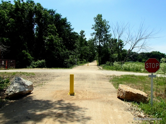 Southwind Rail Trail - Road Crossing - This is a typical road crossing on the Southwind Rail Trail, with bollards to keep out motor vehicle traffic. Road traffic has right-of-way.